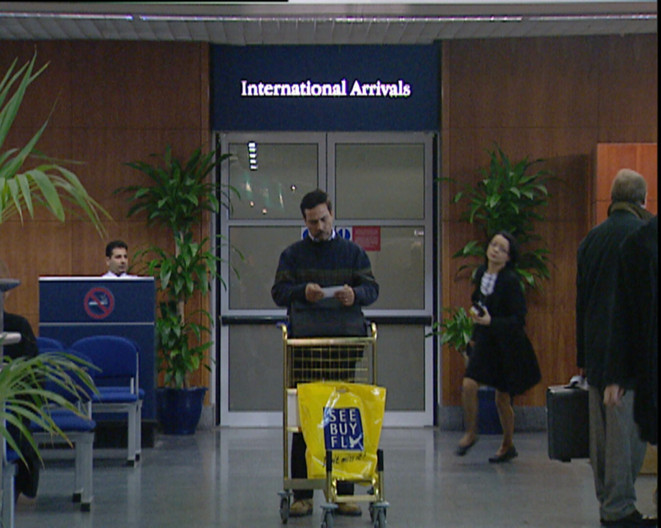 JOINT38a2_MARK WALLINGER_Threshold_to_the_Kingdom_2000_projected_video_installati